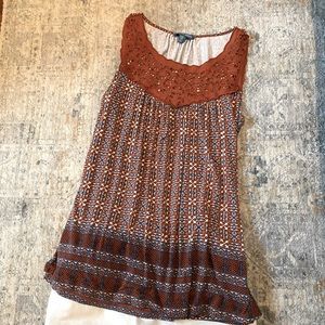 Rust with blue sleeveless top